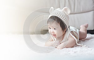 Closeup cute baby girl in funny motion with copy space