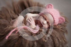 Closeup infant baby girl sleeping at background. Newborn and mothercare concept photo