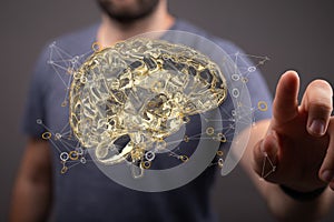 Closeup of a 3d rendered brain and a man touching photo