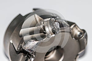 Closeup of the damaged indexable milling cutter for CNC milling machine