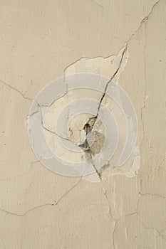 Closeup of damaged plasterwork on wall