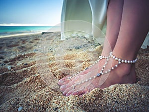 Closeup Decorated Bridal Foots of Beautiful bride at beach, Bali.