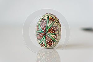 Closeup, of decorated wooden Easter egg. Concept Easter.