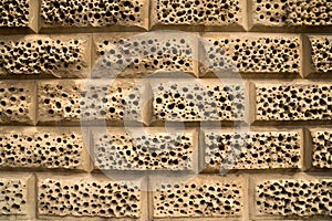 Closeup decoration sandstone hole bricks wall background