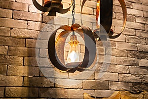 Closeup of Decorative antique edison style filament light bulbs on brick wall