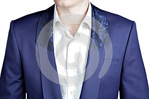 Closeup deep blue blazer, shawl collar with a wide lapel.