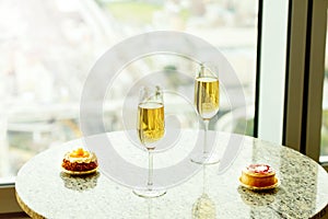 Closeup of delicious cake and glass of champagne