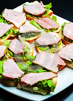 Closeup of delicious ham and salad canapes