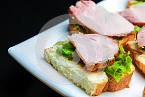 Closeup of delicious ham and salad canapes