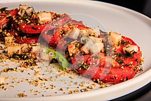 closeup delicious sliced tomato decorated with assorted herbs