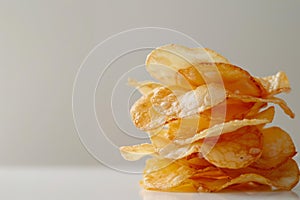 Crispy potato chip stack on neutral background