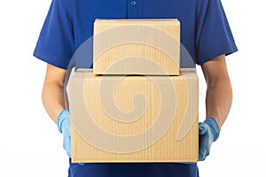 Closeup delivery man hand in medical gloves holding cardboard boxes isolated on white background