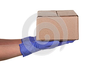 Closeup delivery woman hand in medical gloves holding cardboard box isolated on white background, Delivery service concept