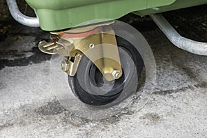 closeup description of heavy duty casters (large wheelie bins) stock images, selective focus.