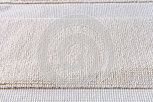 Closeup detail of beige carpet texture