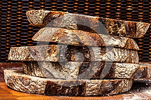 Closeup detail of bread slices cut from round artisan baked loaf