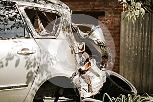Closeup detail of fully destroyed car in road accident.
