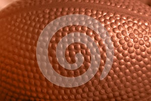 Closeup detail of orange rubber ball texture background