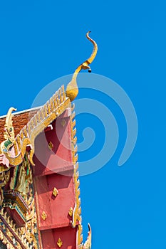 Closeup detail of ornately decorated temple roof in bangkok