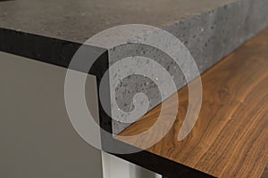 Closeup detail shot of gray terrazzo kitchen countertop with black marble
