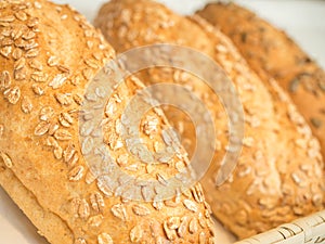 Closeup details of fresh baked Avena Vital Bread with oat flakes
