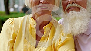 Closeup details in front of the camera posing amazing looking old couple smiling large they are very charismatic. 4k