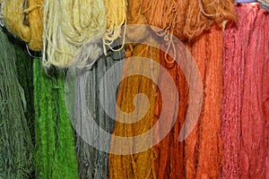 Closeup of different colorful fabric wools in a market