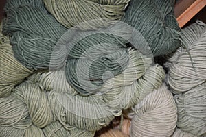 Closeup of different green wools on top of each other