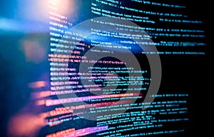 Closeup digital code on computer screen. Lines of programming language visible, technology, cybersecurity concepts