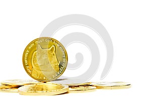 Closeup of a digital dog coin on a bunch of golden coins isolated on a white background