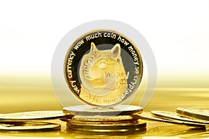 Closeup of a digital dog coin on a bunch of golden coins isolated on a white background