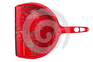 Closeup of dirty red dustpan on white background