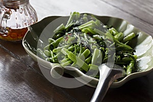 Closeup of a dish of fried water spinach