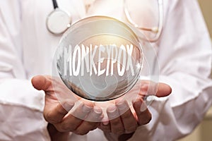 Closeup doctor holding a transparent bubble with monkeypox concept photo