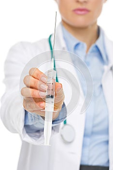 Closeup on doctor woman giving syringe