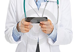 Closeup on doctor woman writing sms