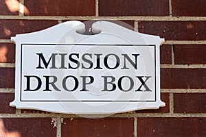 Closeup of donation sign for missions drop box