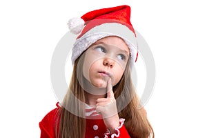 Closeup dreamy christmas girl wearing a santa hat isolated over a white background