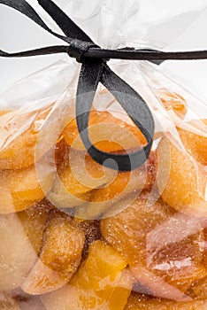 Closeup on dried apricots stacked into luxury plastic bag