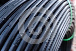 Closeup of drip irrigation tubing in a roll