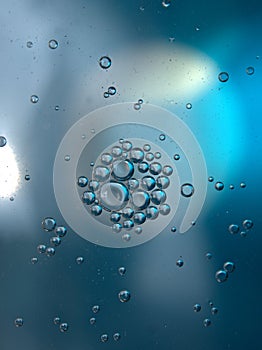 Closeup droplets with blue light background and shiny