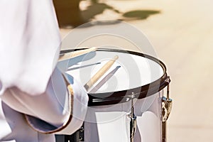 Closeup of a drummer`s hand from an ensemble of drummers