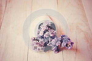Closeup dry purple flowers on wood table