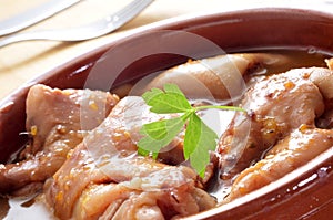 Manitas de cerdo, stewed pig feet typical of Spain photo