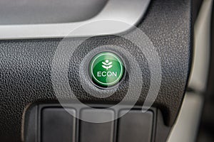 Closeup of Economic button in a car