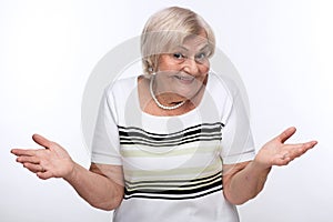 Closeup of elderly woman shrugging shoulders