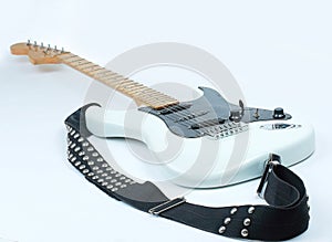 Closeup.electric guitar with metal strap. isolated on white.