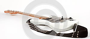 Closeup.electric guitar with metal strap. isolated on white.