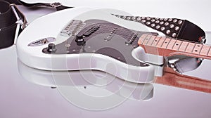 Closeup.electric guitar with strap isolated on white background.