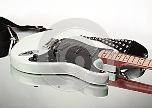 Closeup.electric guitar with strap isolated on white background.